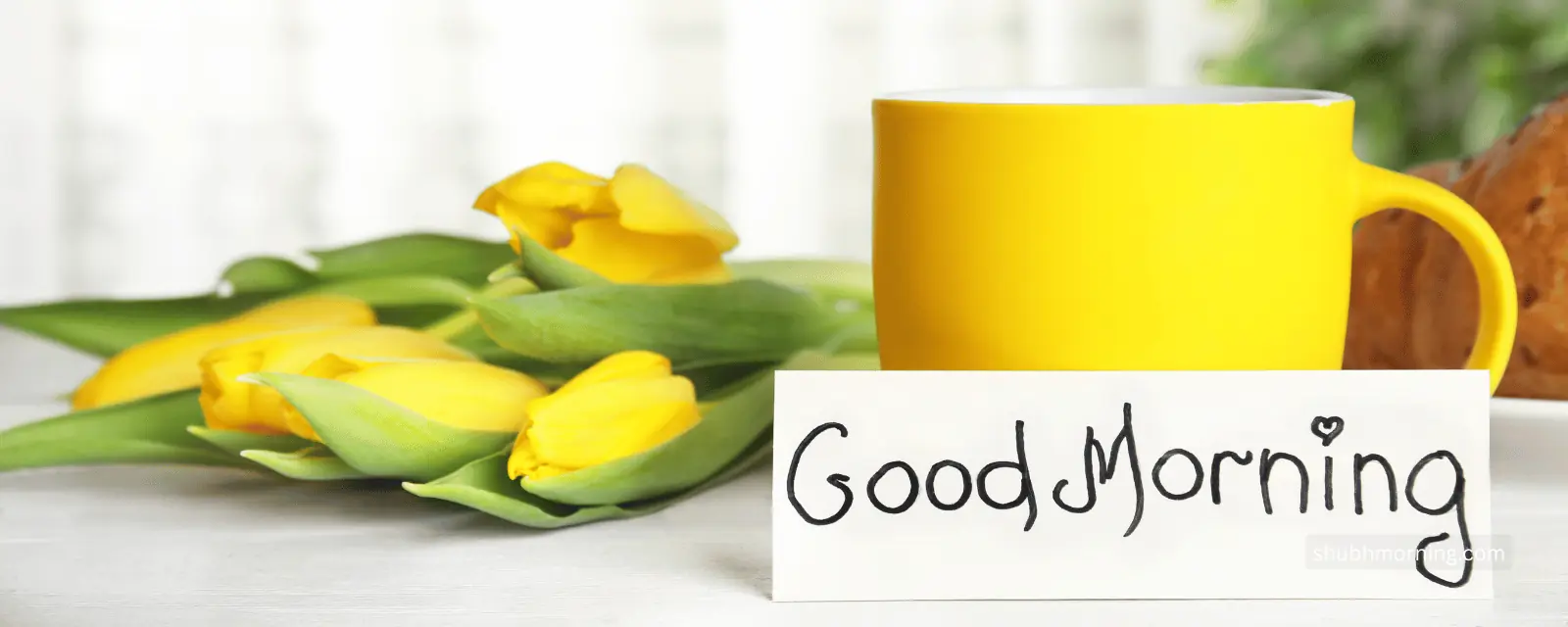 Good Morning card beside a yellow mug and yellow tulips